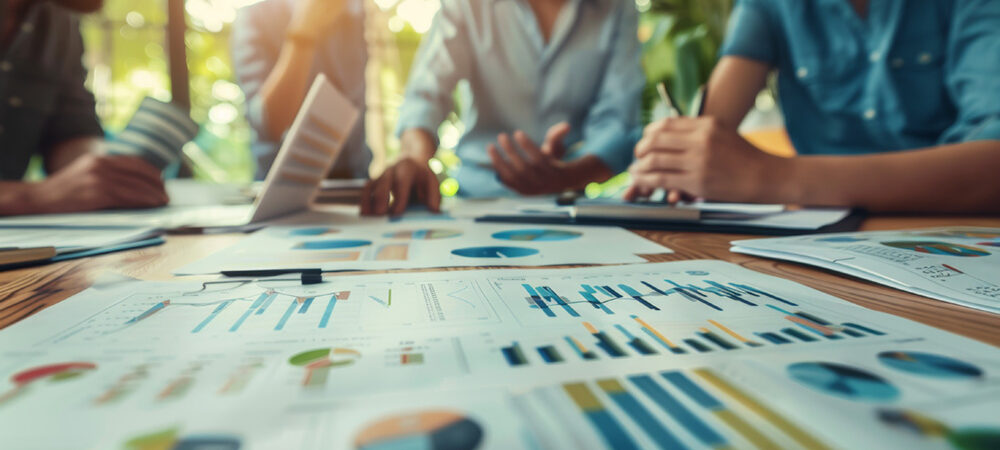 close-focus-business-financial-charts-colorful-pie-graphs-laid-out-desk-indicating-data-analysis-strategic-planning close-focus-business-financial-charts-colorful-pie-graphs-laid-out-desk-indicating-data-analysis-strategic-planning